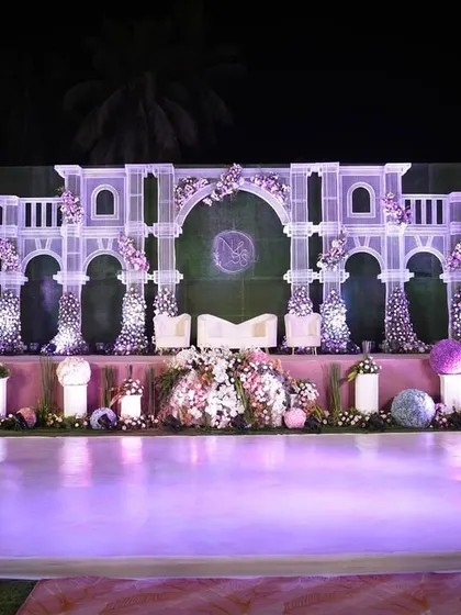 This reception stage was designed to be the romantic centerpiece of the evening. Featuring intricate white architectural details, soft floral accents, and elegant uplighting, it provided a beautiful backdrop for the couple throughout the celebration.