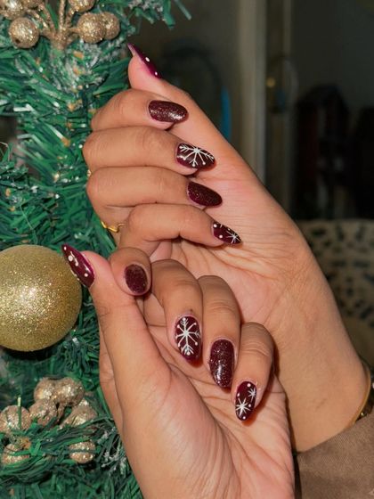 A close-up of the intricate, hand-painted snowflake design. We love adding these special touches for the holidays.