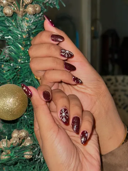 A close-up of the intricate, hand-painted snowflake design. We love adding these special touches for the holidays.