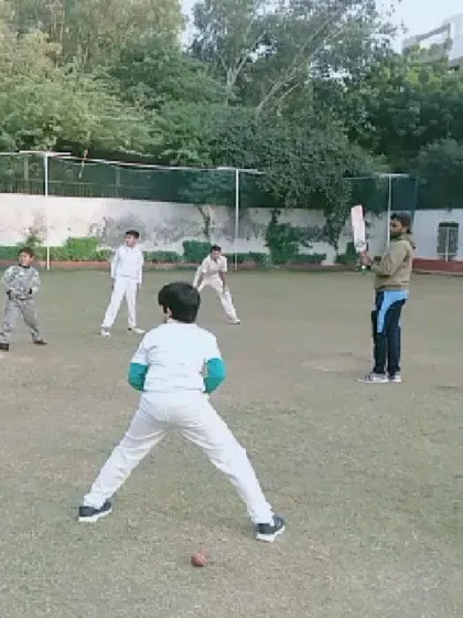 Young trainees participate in a fielding practice session. We start building fundamental skills like catching and ground fielding from a very early age.