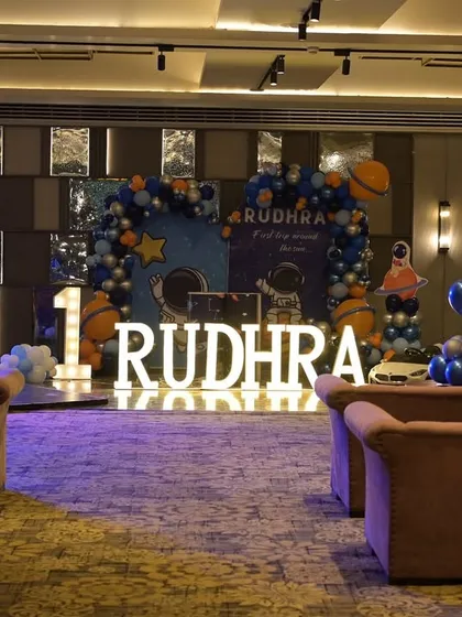 A wide shot of the venue, showing how we used balloon arrangements and lighting to create a cosmic atmosphere throughout the room.