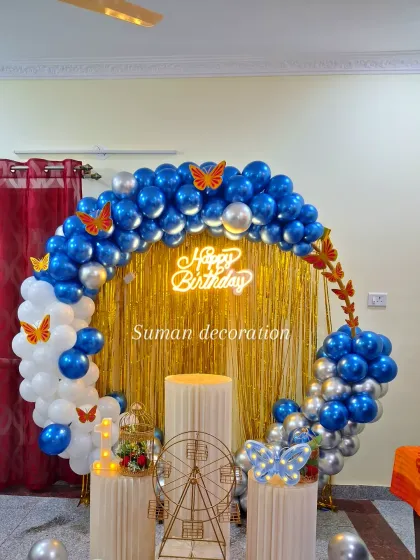 A close-up of the blue and white butterfly theme, highlighting the neon sign and decorative props like a miniature Ferris wheel and birdcage.