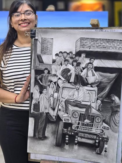 The final reveal. A student proudly presents her large-scale charcoal drawing, a complex scene capturing a group of people on and around a jeep, showcasing her skill in composition and portraiture.