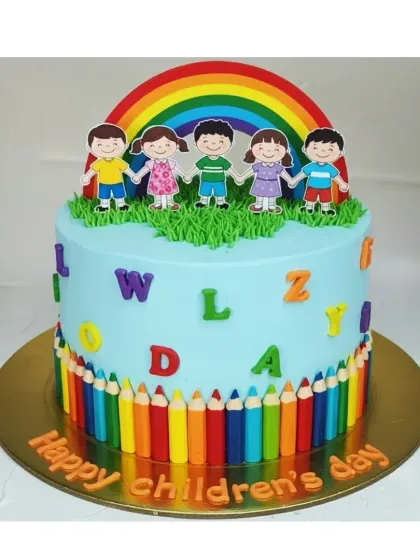 A colorful cake to celebrate Children's Day. This tall choco-vanilla cake is decorated with a rainbow, happy children, and a border of colorful pencils.