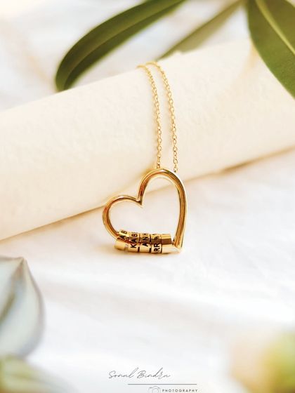 I shot this as a quiet personal project, with no brief, just a heart-shaped pendant and a moment I wanted to freeze. The soft fabric and gentle framing create a sense of peace and simple beauty.