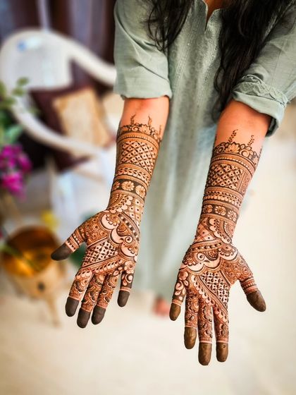 Another view of the skyline henna, showing the intricate details on the palms.