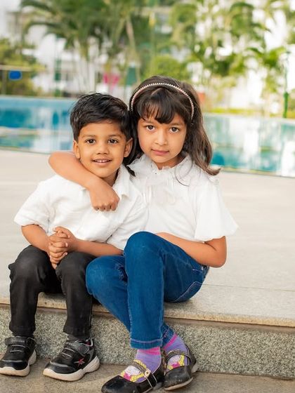 A sweet portrait of a brother and sister by the pool. Capturing the special bond between siblings is one of my favorite things to do.