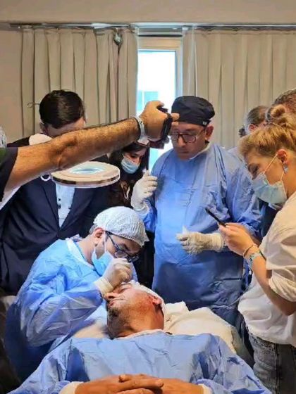 A live demonstration of FUE hair transplant surgery at the 1st FUE Global Meeting in Cyprus. International workshops like these provide exposure to different patient cases and surgical environments.