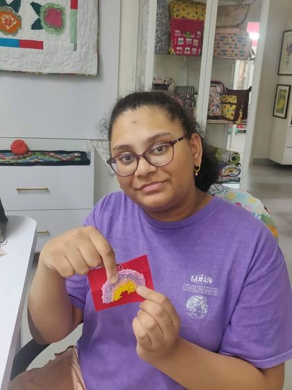 A close-up of a student's work, a small rainbow design perfect for a first-time project.