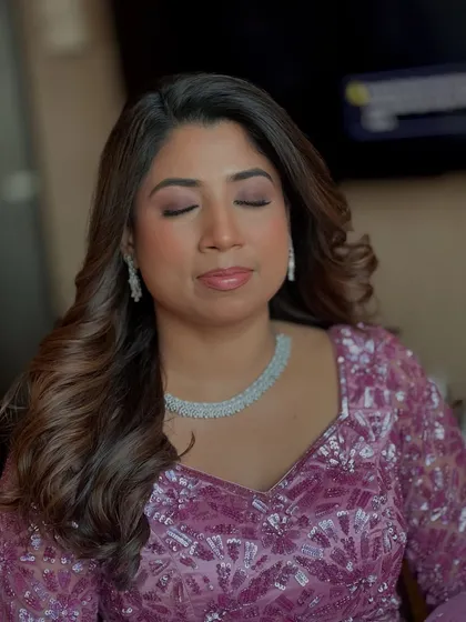 A close-up of Hiral's party look. The glossy skin and shimmering eyeshadow create a glamorous yet fresh feel.