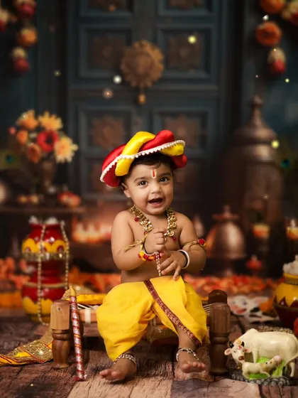 My heart feels full when we do these special Janmashtami shoots. Seeing this little one as Krishna, with his happy smile and all the traditional details, is a blessing. We create these beautiful setups to celebrate our dharam and culture.