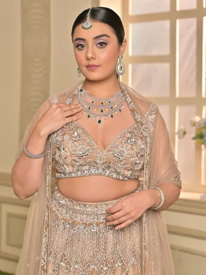 A portrait that captures the 'glass skin' makeup look. The skin is dewy, the lips are a soft nude, and a delicate shimmer on the eyes adds a touch of sparkle.