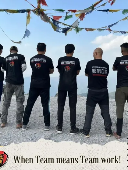 A photo of the instructor team on a mountain summit with the caption, "When Team means Team work!"