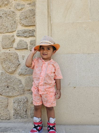 This little boy is rocking our orange printed co-ord set. The vibrant color and playful pattern bring so much joy, and the soft cotton fabric ensures he stays comfortable all day long.