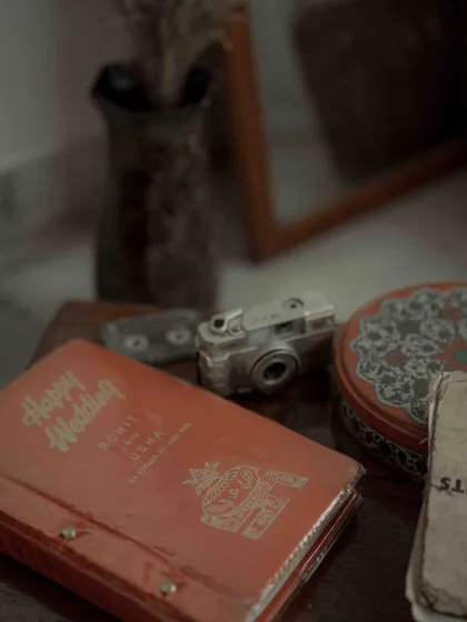 A nostalgic still life of a vintage wedding album. This image, with its warm tones and old camera, speaks to my love for creating memories that will be cherished for generations.