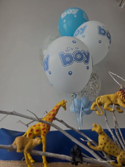 A close-up of the animal figures on the branches of the jungle hamper.