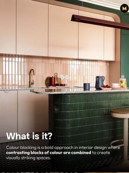 Color blocking is a bold design approach where contrasting blocks of color are combined to create visually striking spaces. Here, dark green and pink kit-kat tiles create a playful yet sophisticated kitchen island.
