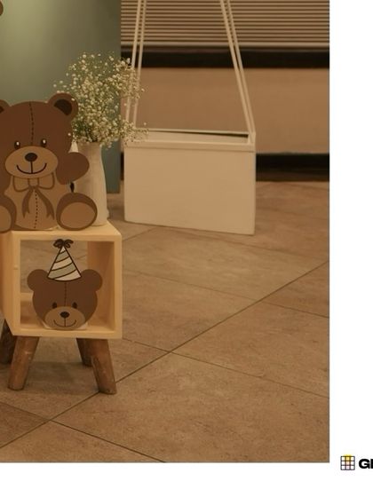 Small wooden teddy bear cutouts used as decorative accents, showing our attention to even the smallest details.