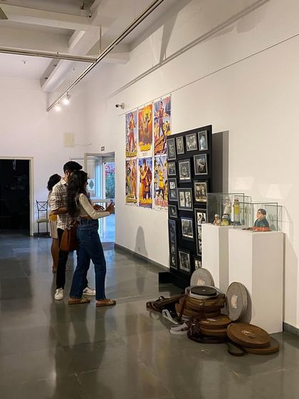 Visitors looking at the large vintage movie posters.