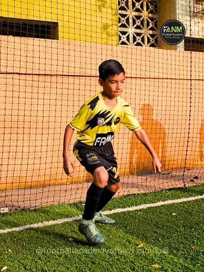 A player practices his stance and balance, fundamental aspects of athletic development.