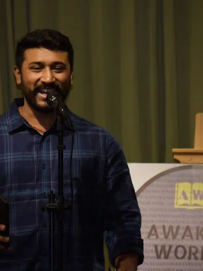 A close-up of an artist's smile as he performs on our stage.
