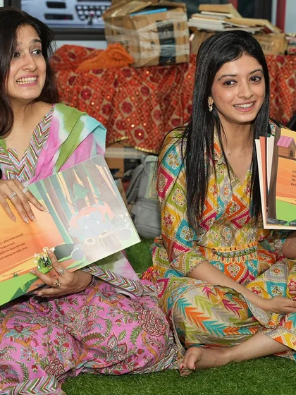 Our co-founders showing the illustrations of 'Jungle Jugalbandi' to the children during a storytelling session.