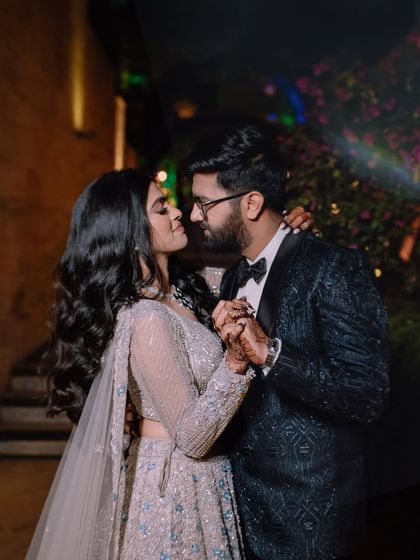 A romantic dance, captured at night. The couple's close embrace and the soft lighting create a very intimate atmosphere.
