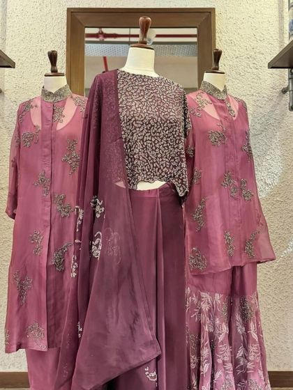 A collection of mauve and wine-colored outfits by Peachoo, showcasing their signature blend of sheer fabrics, prints, and embroidery.
