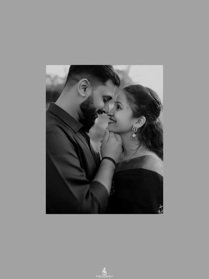 A timeless black and white close-up, focusing purely on the couple's intimate connection and emotion.