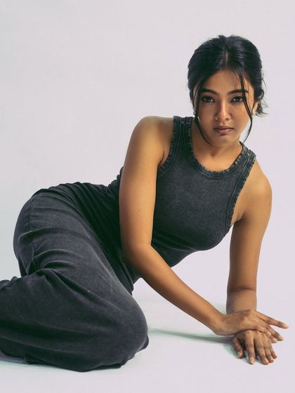 A relaxed, floor-based pose that feels both commercial and editorial.