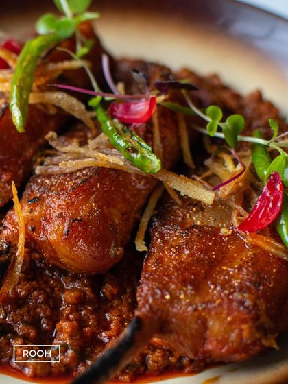 An intimate look at the textures of our Lamb Chop Raara. The rich gravy clings to the succulent meat, promising a burst of flavour in every bite.