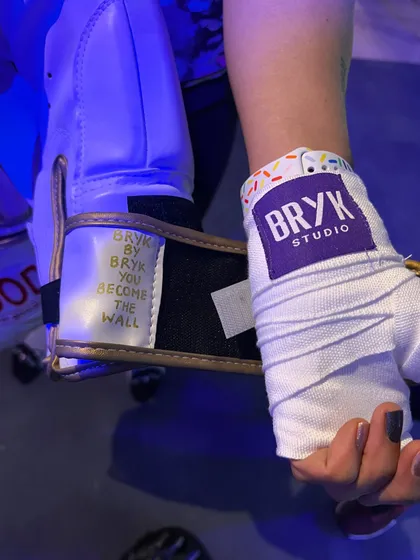 A close-up of our custom BRYK Studio hand wraps and gloves. The gear is part of the experience, a reminder that you are building yourself brick by brick.