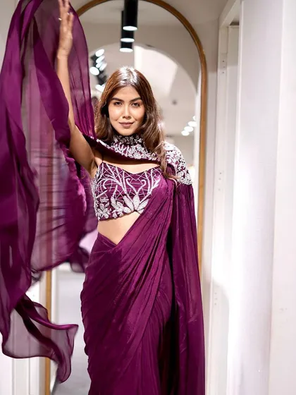 Saree up for the festivities! Add a touch of royalty to your festive look with this majestic dark purple saree.