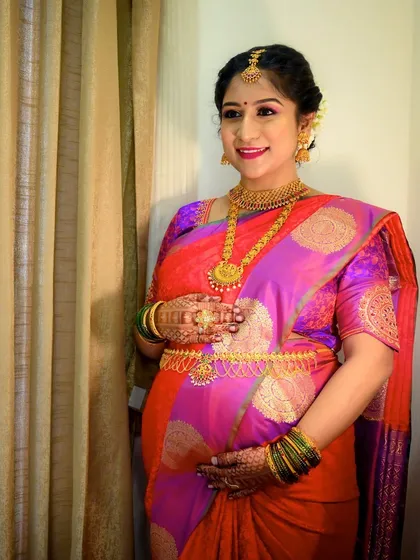 The complete look for this beautiful mom-to-be. The makeup is bright and celebratory, perfect for the happy occasion of her baby shower.