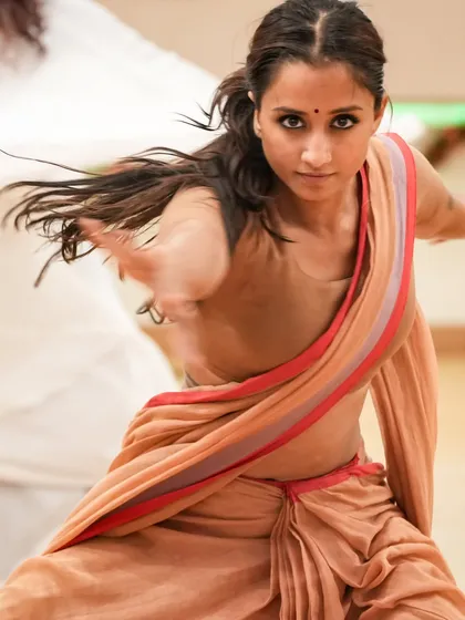An intense, action-oriented shot from rehearsals. This captures the raw energy and focus required during the creation process.