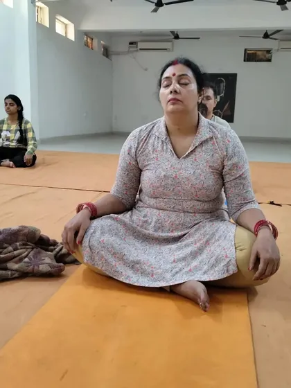 A participant in deep meditation during the Surya Kriya program. The practices offered here are designed to bring balance and stability to one's system.