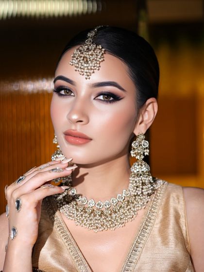 A slightly different angle, showing the flawless base and the way the highlighter catches the light.