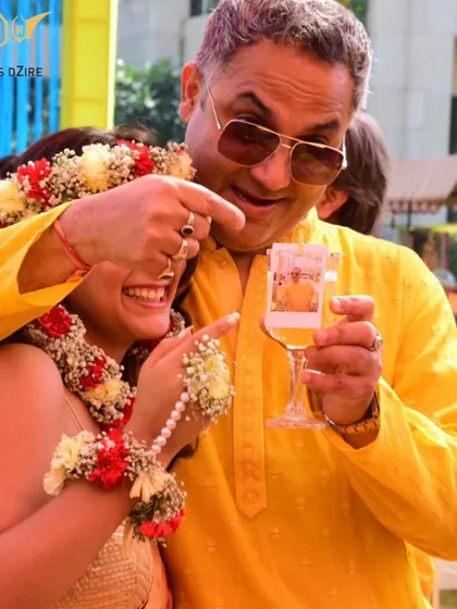 I love adding touches that tell your story. Here, we created a 'photo cocktail' by adding an instant picture of the happy couple to their drink, making for a fun surprise and a great photo opportunity at their Haldi ceremony.