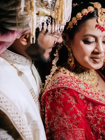 A minimalist bride radiating elegance in red. This shot captures the grace in every detail, with soft glam makeup that enhances her features.