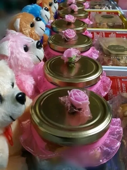 A different view of the affordable return favors, showing the variety of colorful teddy bears included in the order.