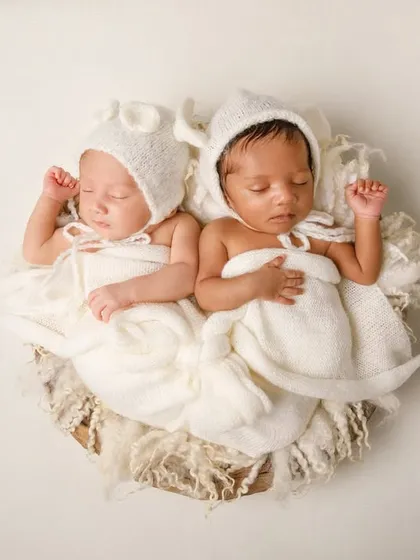 Double the love. Photographing newborn twins is a special joy, and I focus on posing them together to show the incredible bond they already share.