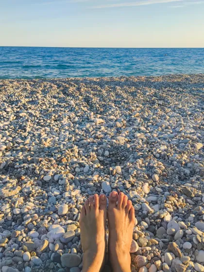 Sometimes the most profound practice is simply to pause. Here, I took a moment to feel the stones under my feet and listen to the ocean. My retreats are built around creating space for these quiet moments of connection and gratitude.