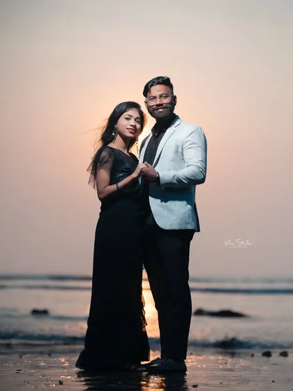 A beautiful silhouette against the setting sun. This full-length portrait on the beach is dramatic, romantic, and utterly timeless.