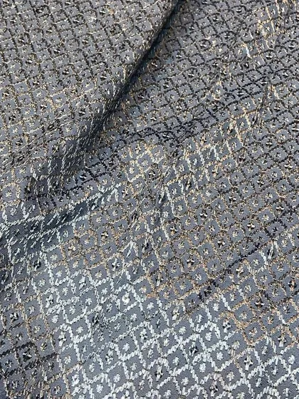 A modern take on Chikankari, this grey fabric features black and silver threadwork, offering a contemporary choice for a stylish kurta or short kurta.