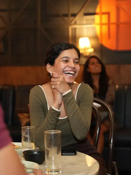 A guest's hands clasped in anticipation and amazement. It's these small, candid moments that show the real impact of the performance.
