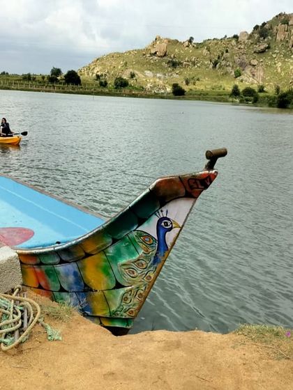 A beautifully painted boat at a lake, a common sight during our trips that include water activities.