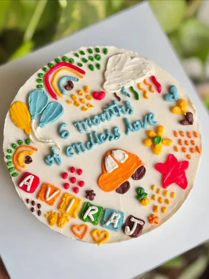 A top-down view of the doodle art cake, showcasing all the cute, colorful elements that tell a story of six months of love.