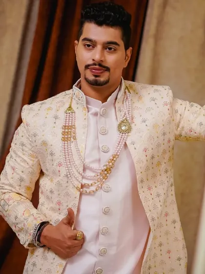 The groom posing in his wedding sherwani. My styling ensures that you look great from every angle, capturing the elegance of your outfit.
