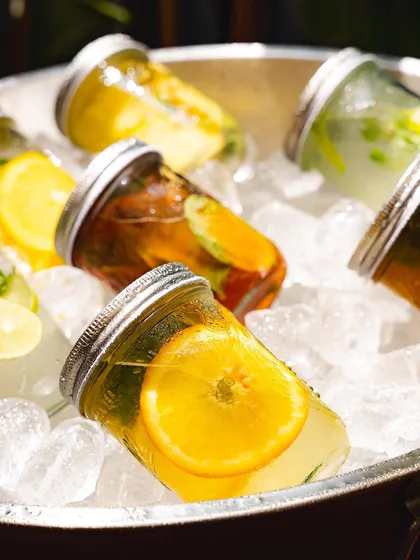 A bucket of our assorted house-made beverages on ice, ready for a party. We can provide a full bar of non-alcoholic options for your event.