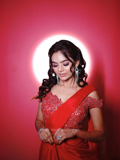 A final look at the stunning blouse and the soft, wavy hairstyle that complements this modern ethnic look.